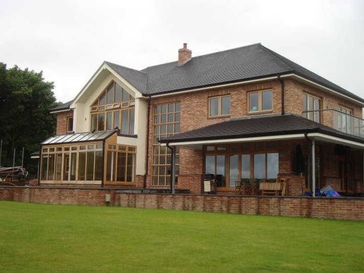 Rear elevation of the two-storey new build with a covered veranda